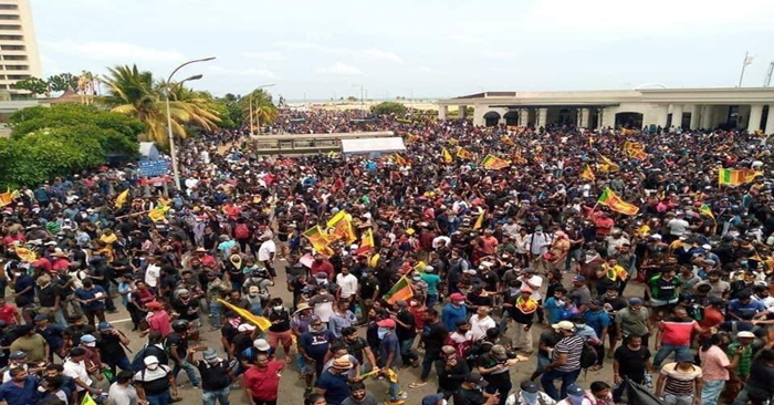  In Sri Lanka, protesters capture Rashtrapati Bhavan, Rajapaksa escapes, waving posters at the stadium